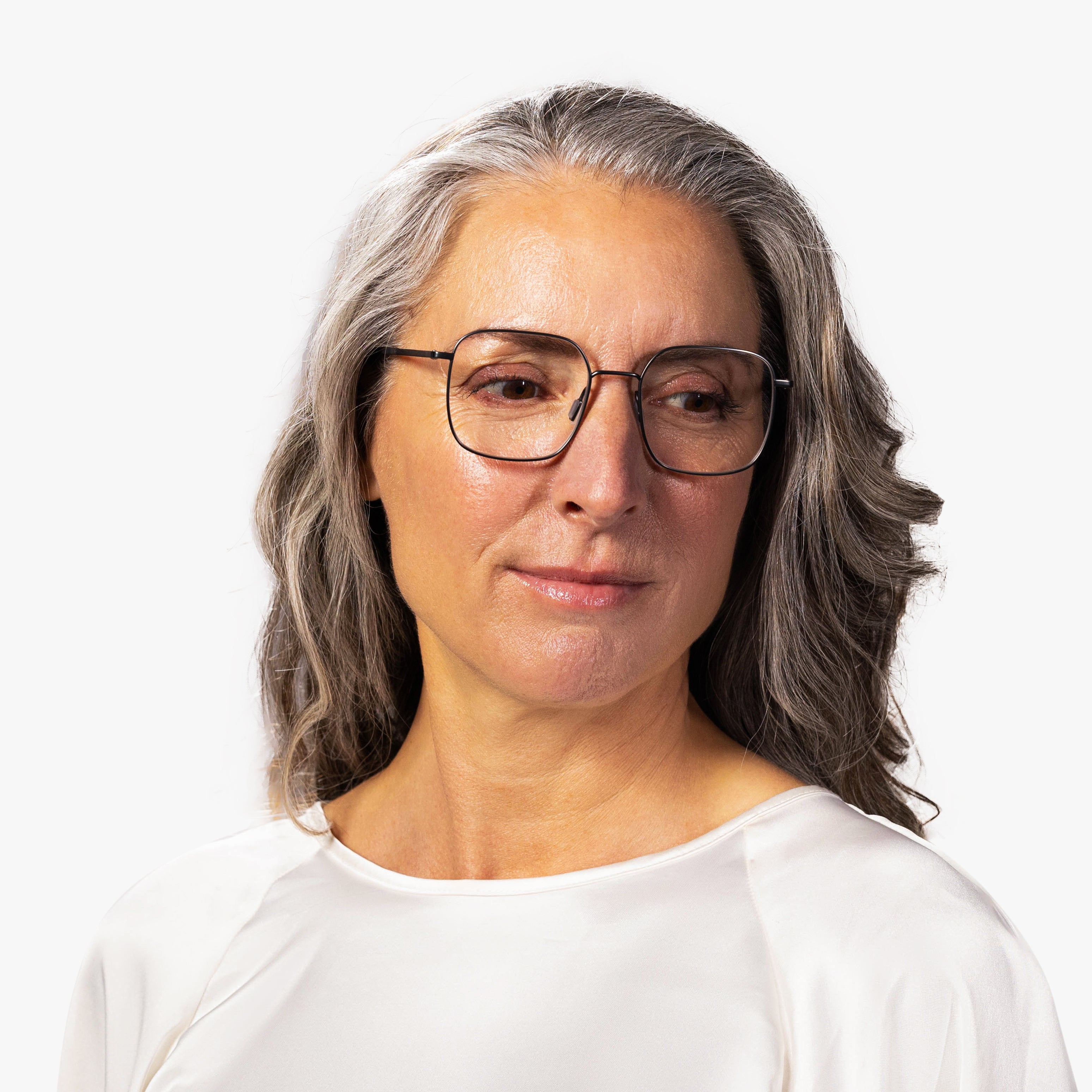 Person wearing Båstad Gun glasses with a thin black frame