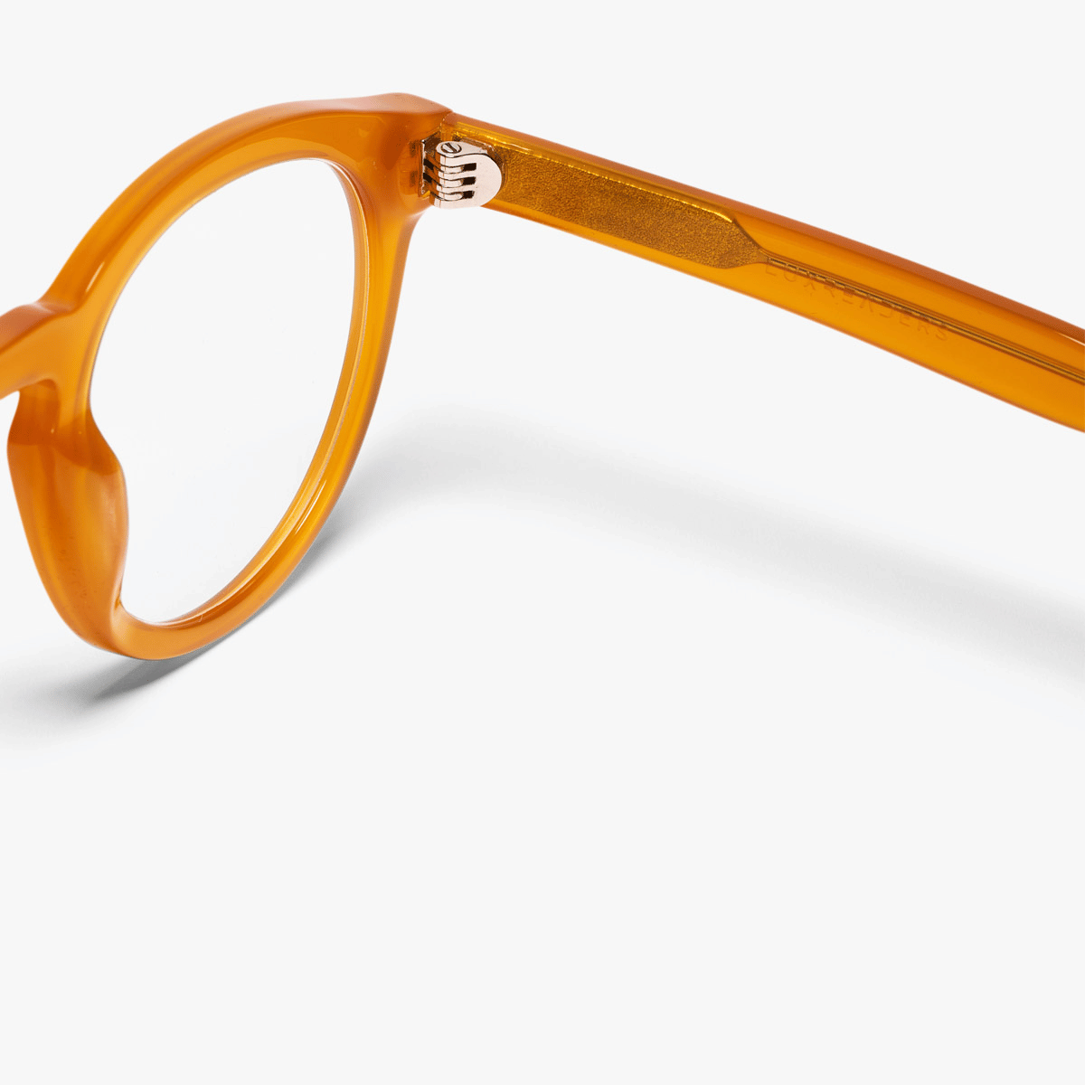 Round crystal honey reading glasses with Luxreaders on the temple