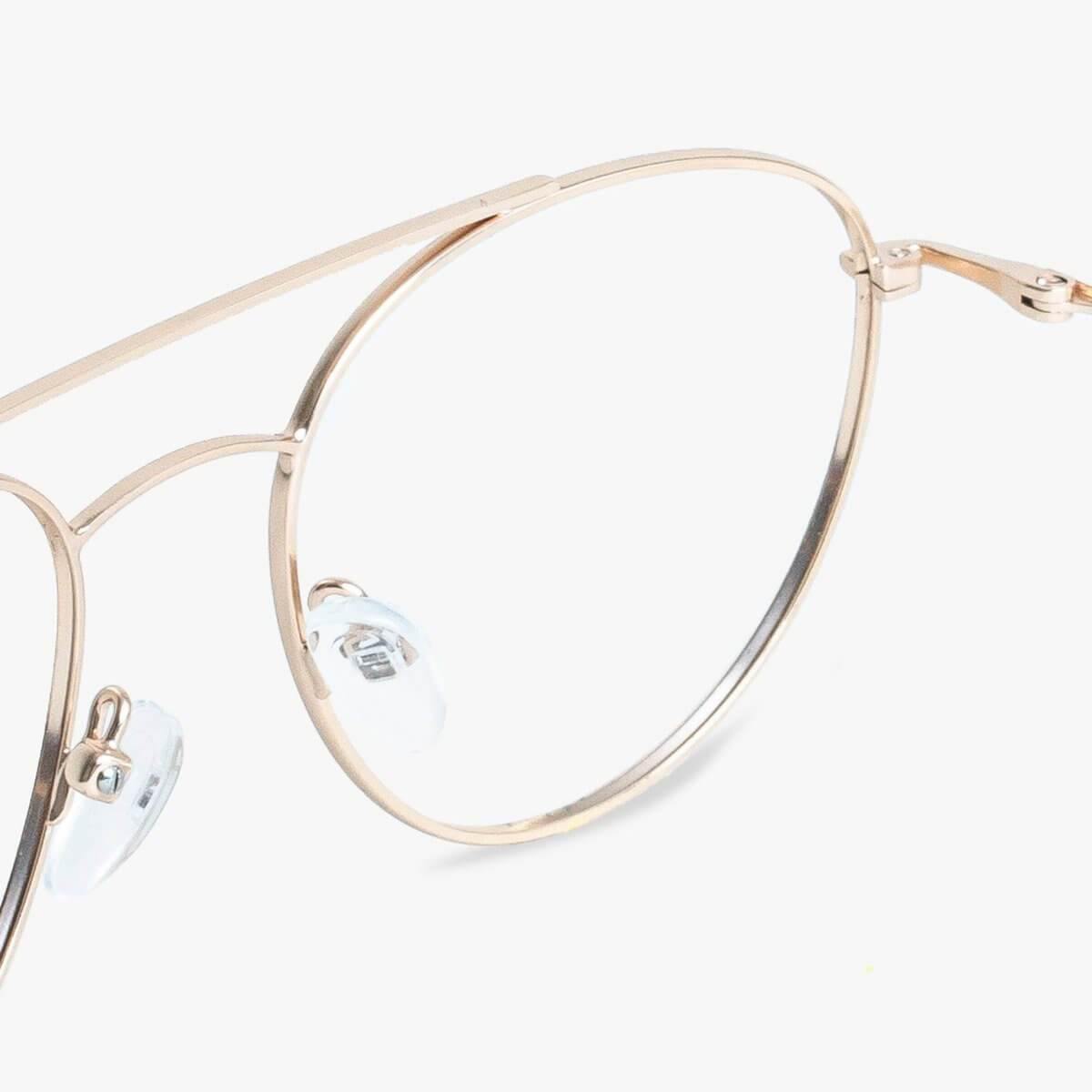 Thin gold-framed glasses with clear nose pads and sleek design
