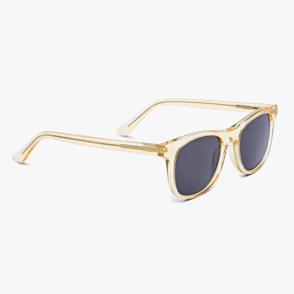 Crystal lemon sunglasses with dark lenses on a white background