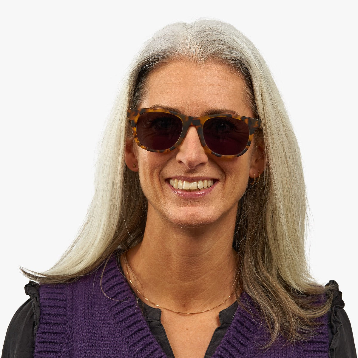 Person wearing tortoiseshell sunglasses