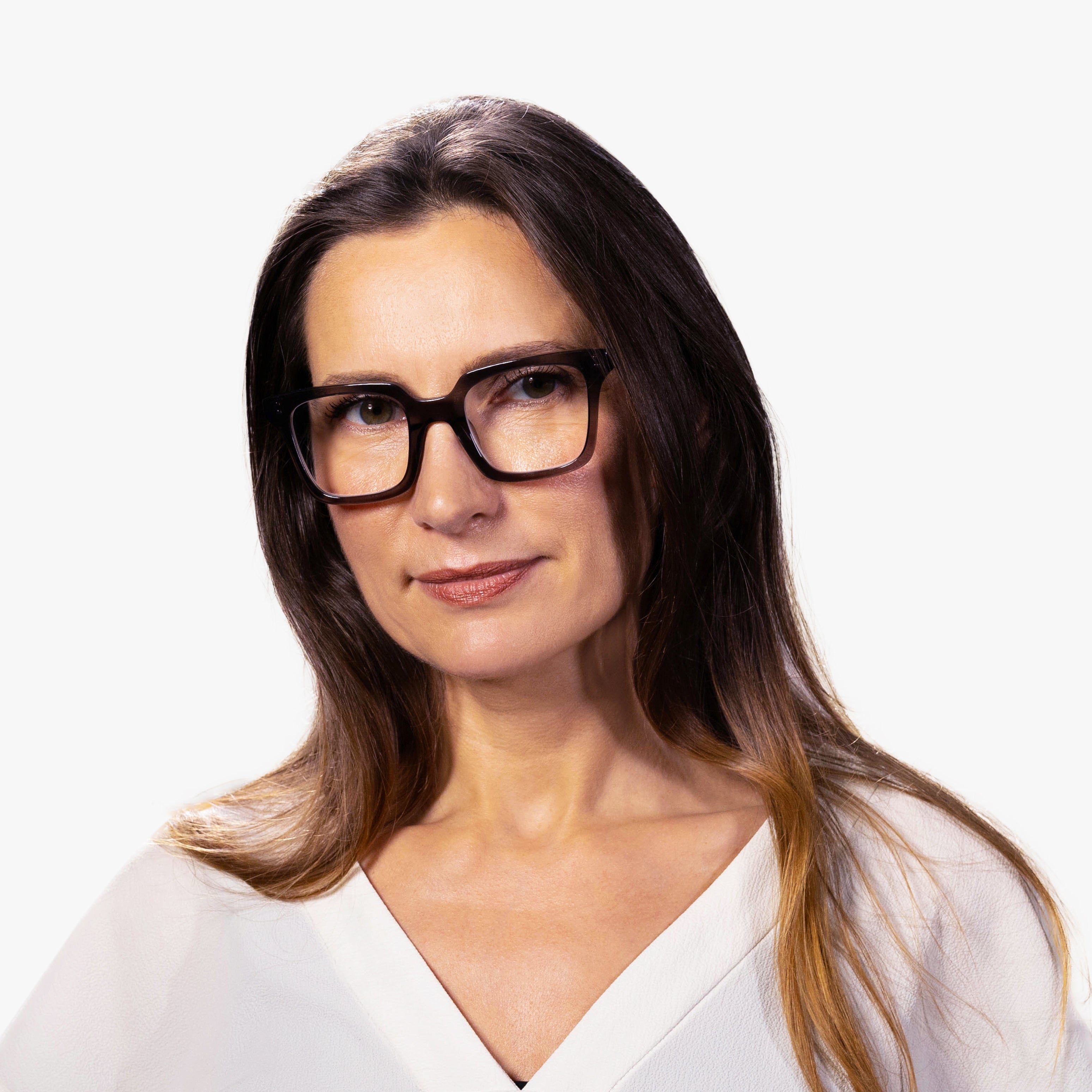 Person wearing square crystal grey reading glasses